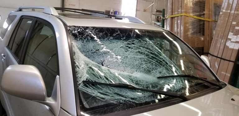 SUV with shattered windshield before replacement