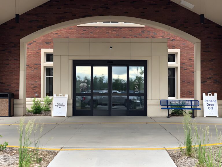 Automatic sliding door entrance under an archway