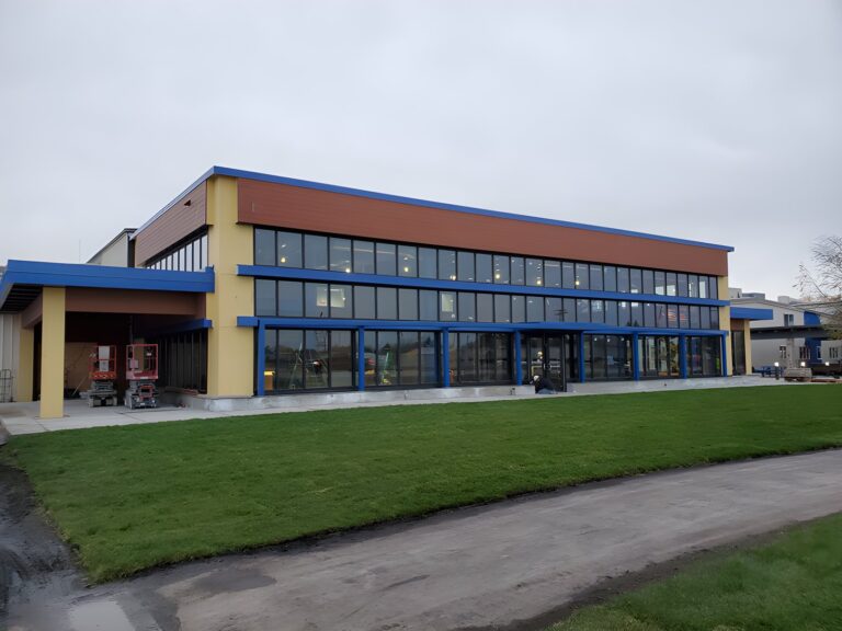 Three-story building with curtain wall glazing
