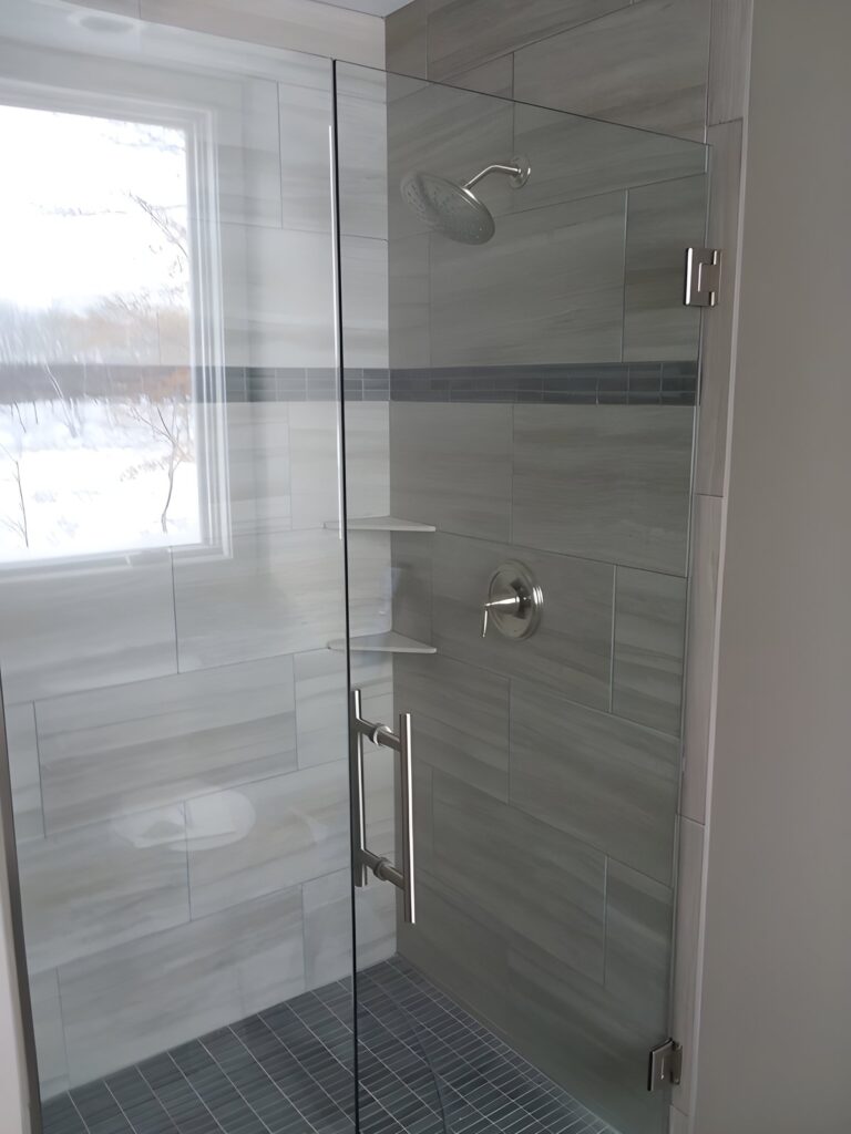 Frameless glass shower panel and door