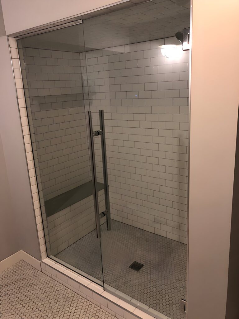 Frameless glass shower door with long handle